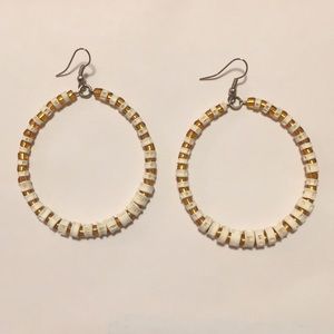 Women’s gold and white hoop earrings